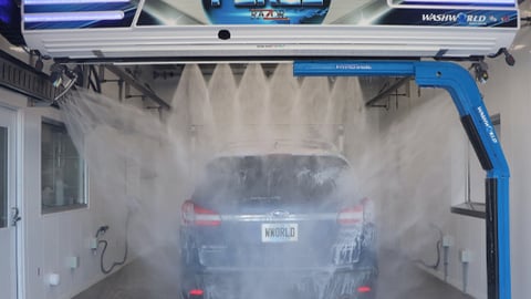 An SUV going through the car wash