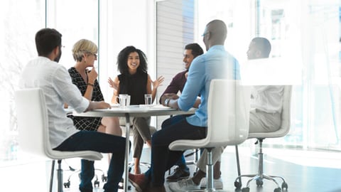 A diverse group of people in an office conference room