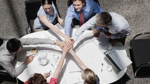 Colleagues working together around a conference table