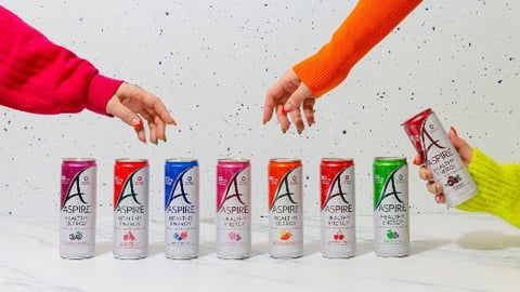 Three hands reaching for Aspire Healthy Energy Drinks