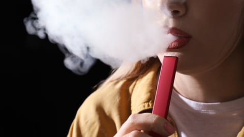 A woman vaping 