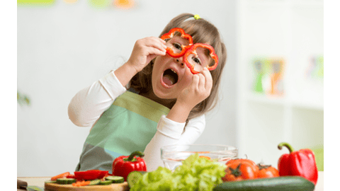 young child cooking