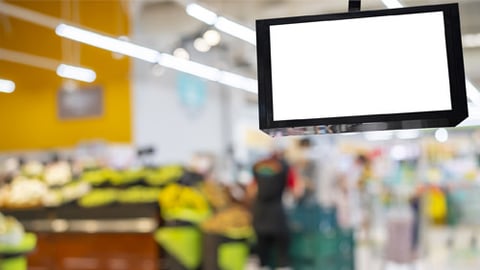 An advertising screen in a grocery store