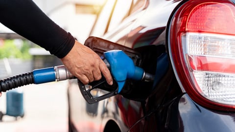 A motorist pumping gas into his car