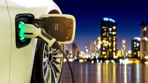 EV Car or Electric car at charging station with the power cable supply plugged in on blurred Night cityscape background.; Shutterstock ID 756737614