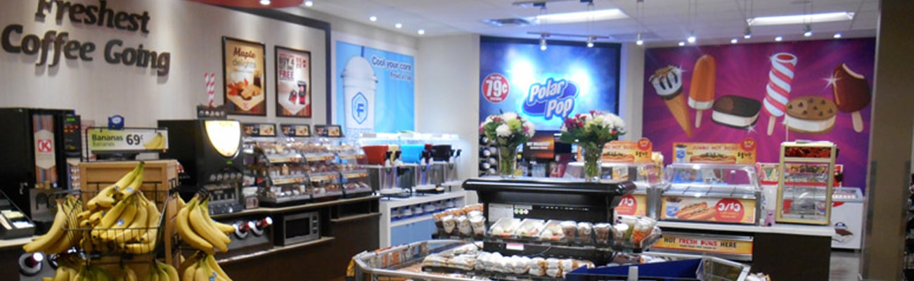 An image of grab and go food and dispensed beverages in a Couche-Tard store