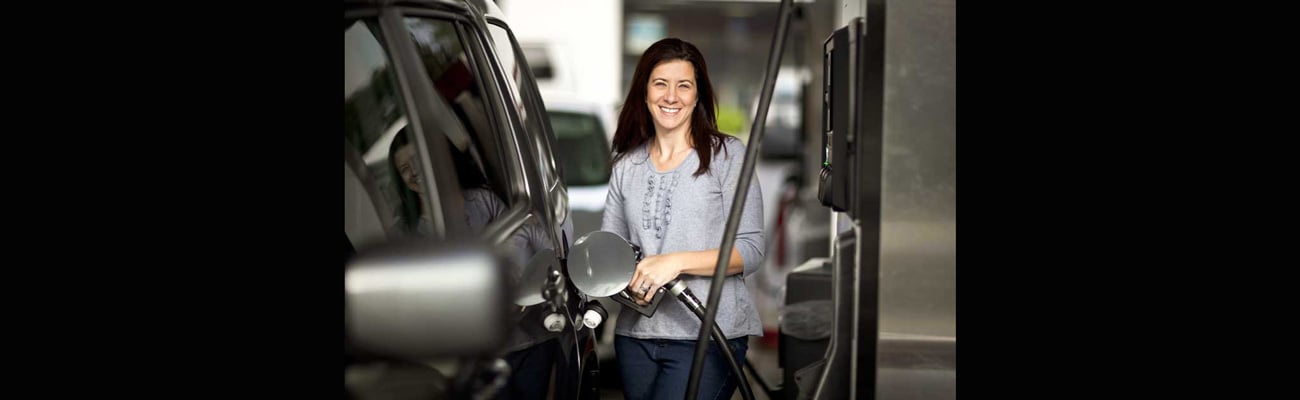 woman pumping gas