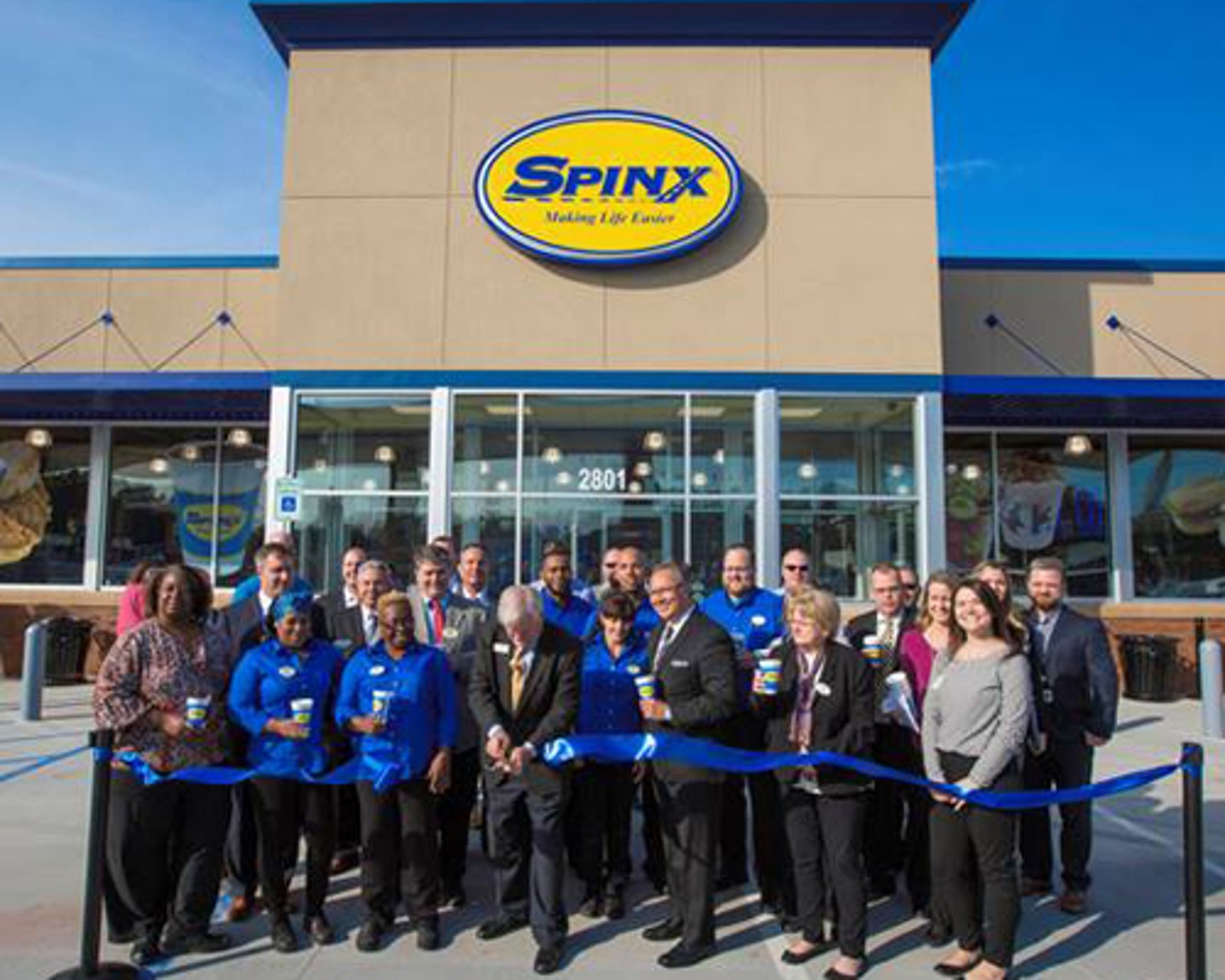 Joined by SPINX associates, Stewart Spinks, SPINX founder and chairman, cuts the ribbon to officially mark the grand opening of the newest Spinx location in Moncks Corner.