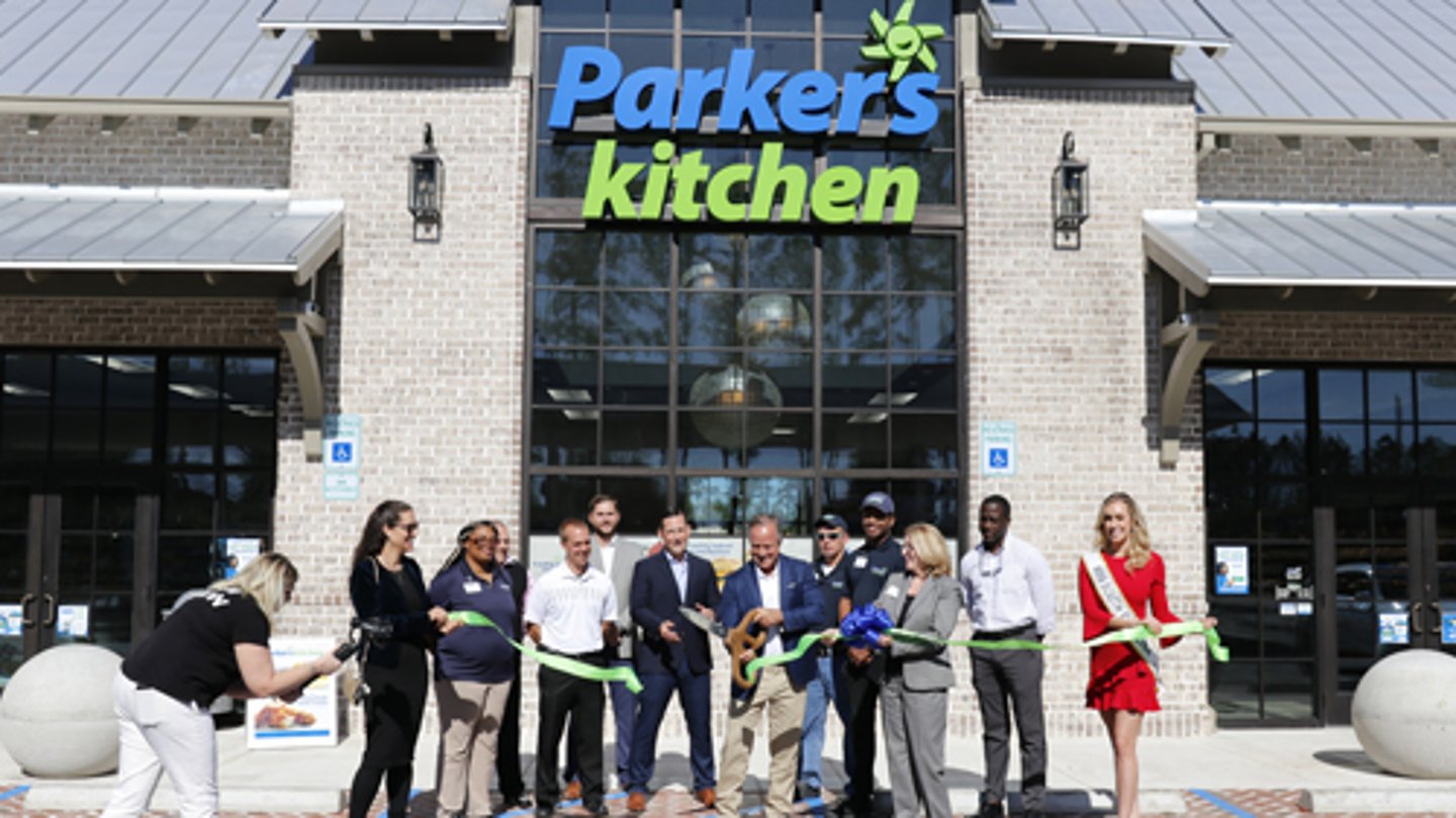 Parker's Kitchen founder and CEO Greg Parker, center, recently cut the ribbon at a new store located at the Cane Bay Shopping Center in Summerville, S.C.