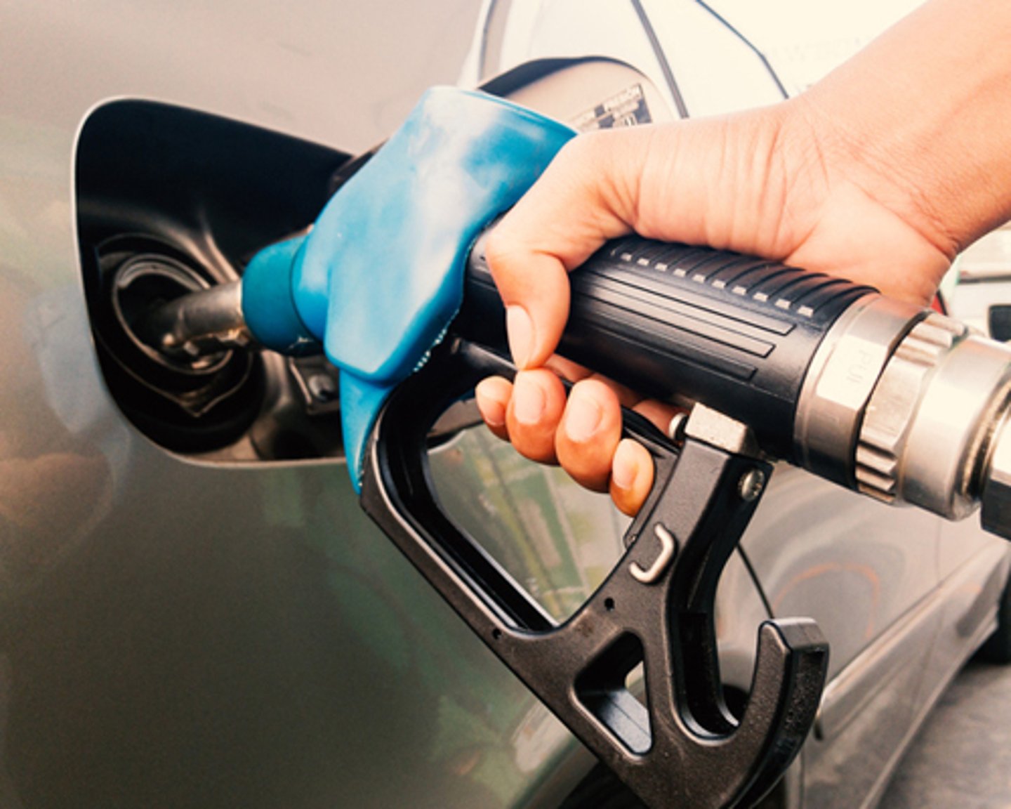 A motorist pumping gas