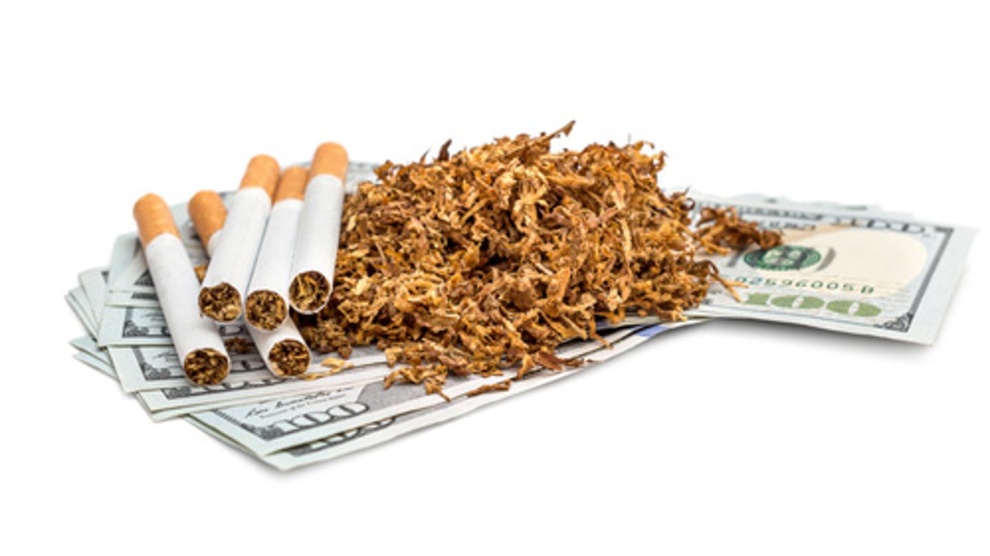 Tobacco and cigarettes with 100 dollar bills