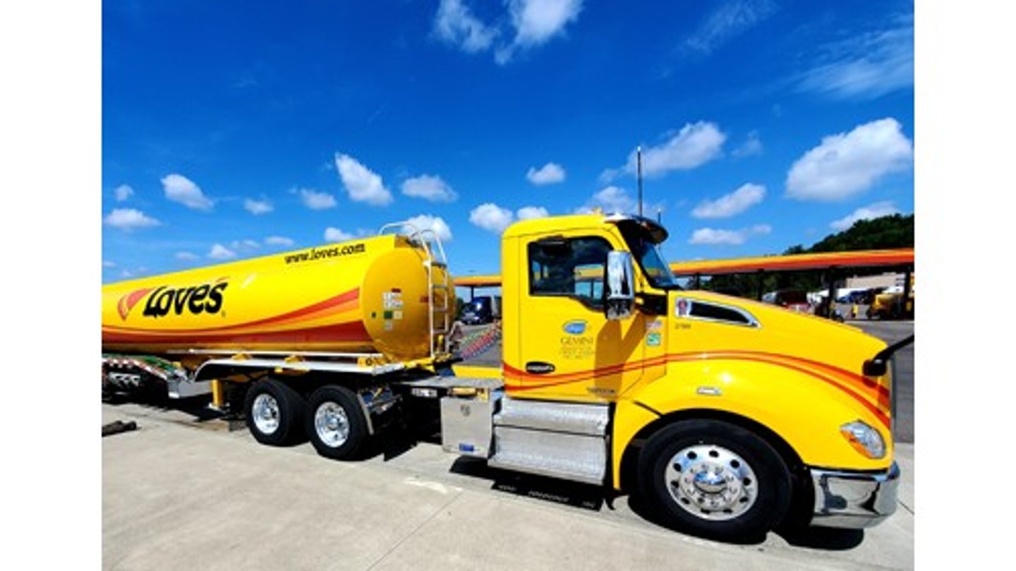 A Love's fuel truck in front of a Love's Travel Stop