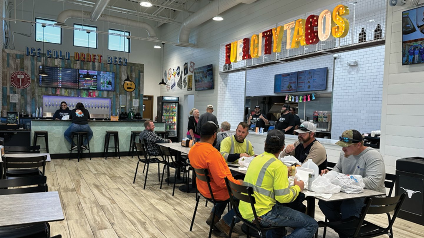 Customers eating tacos at Fuel City