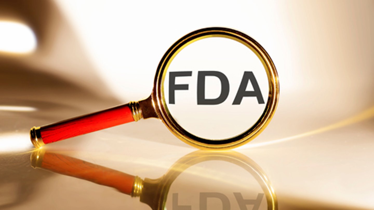 A magnifying glass over the letters FDA