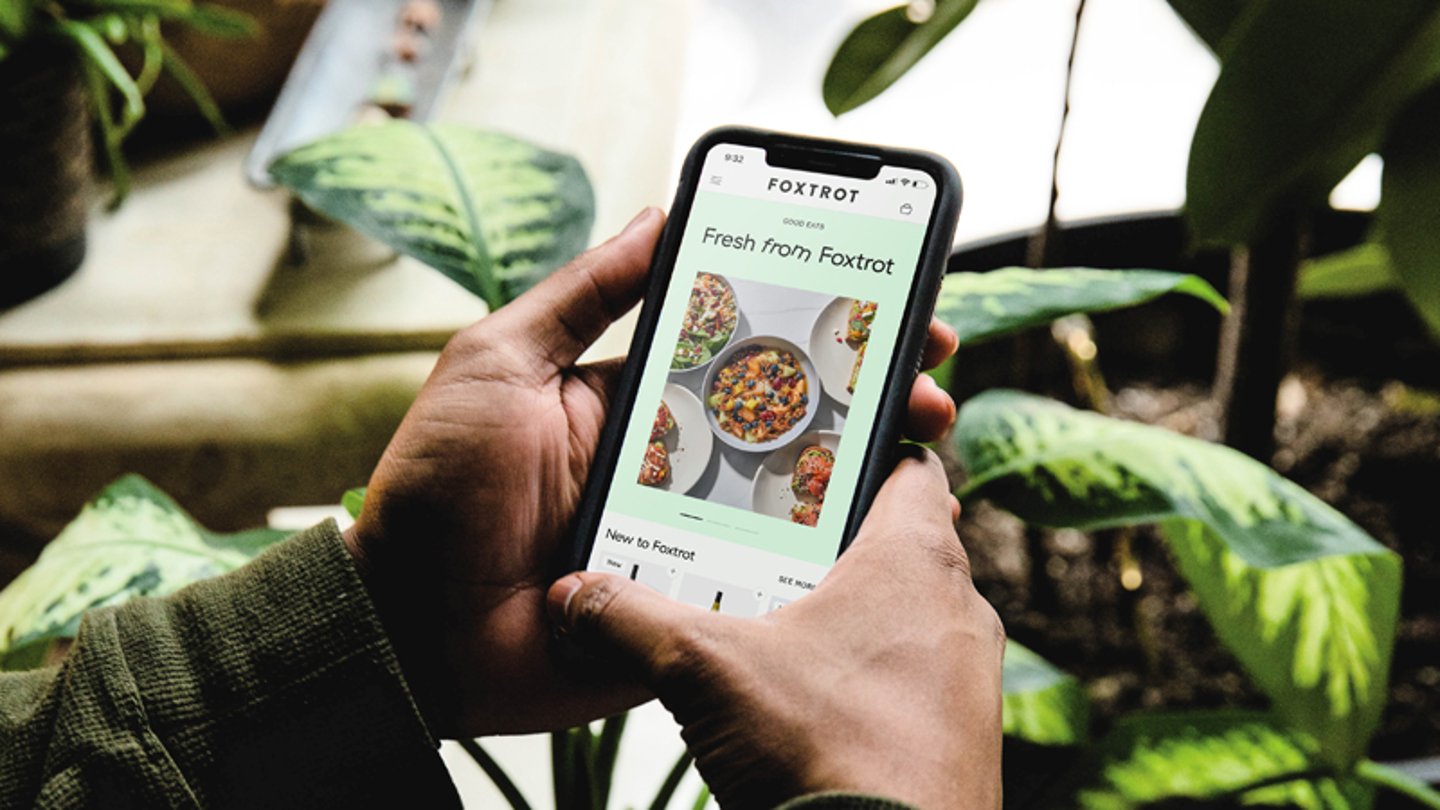 A customer using the Foxtrot mobile app