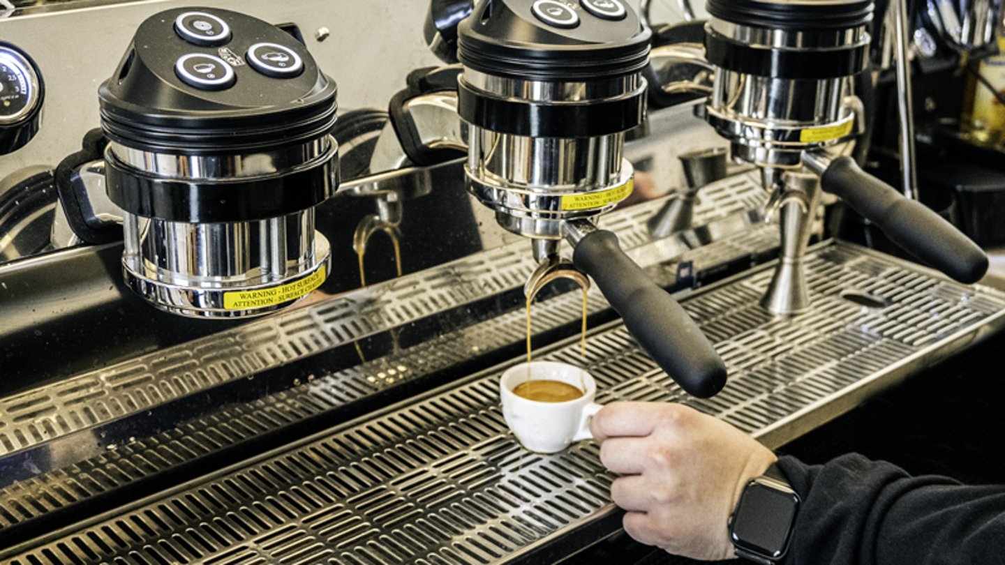 A worker making an espresso at Foxtrot