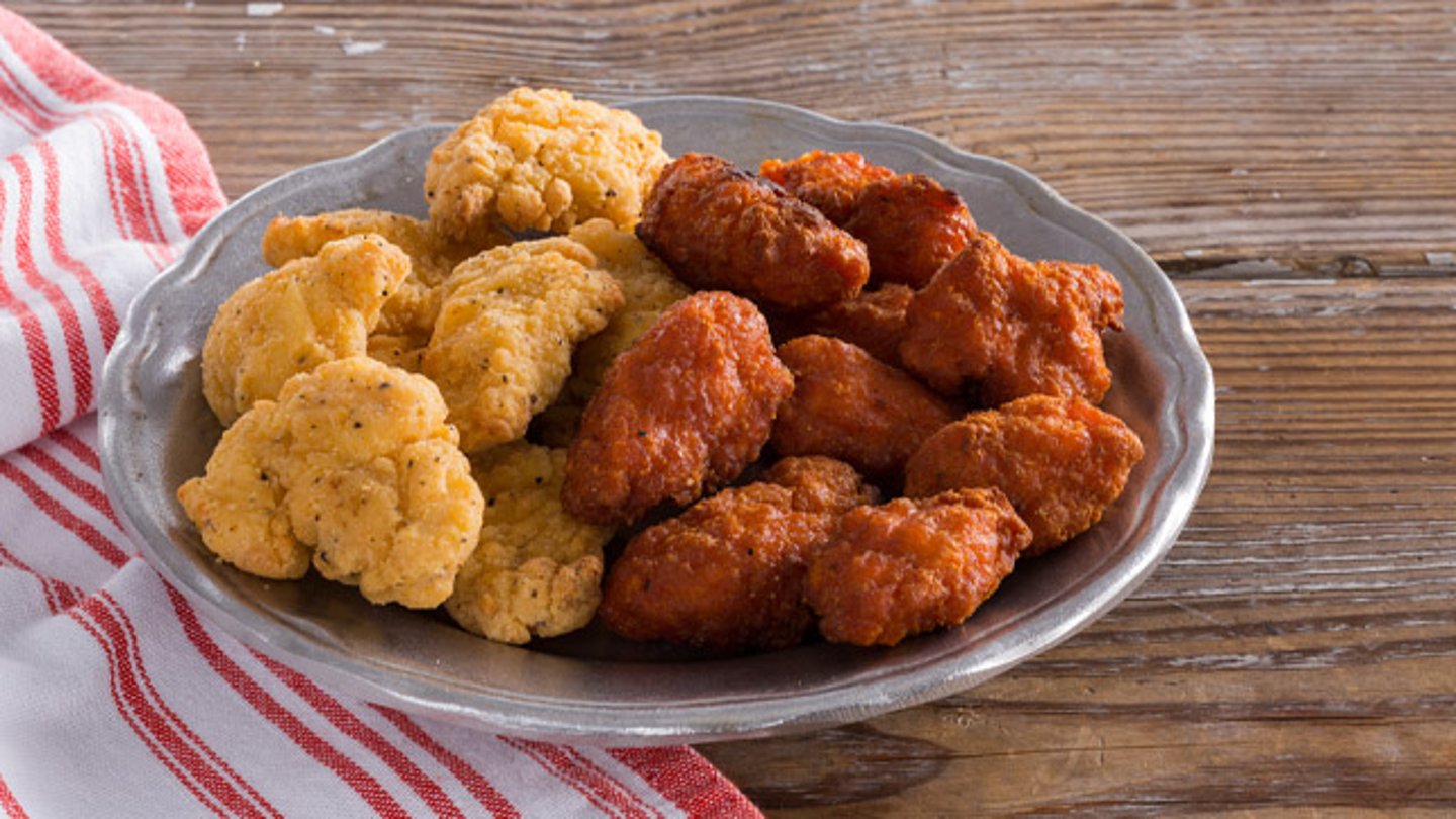 regular and spicy wing bites on a plate