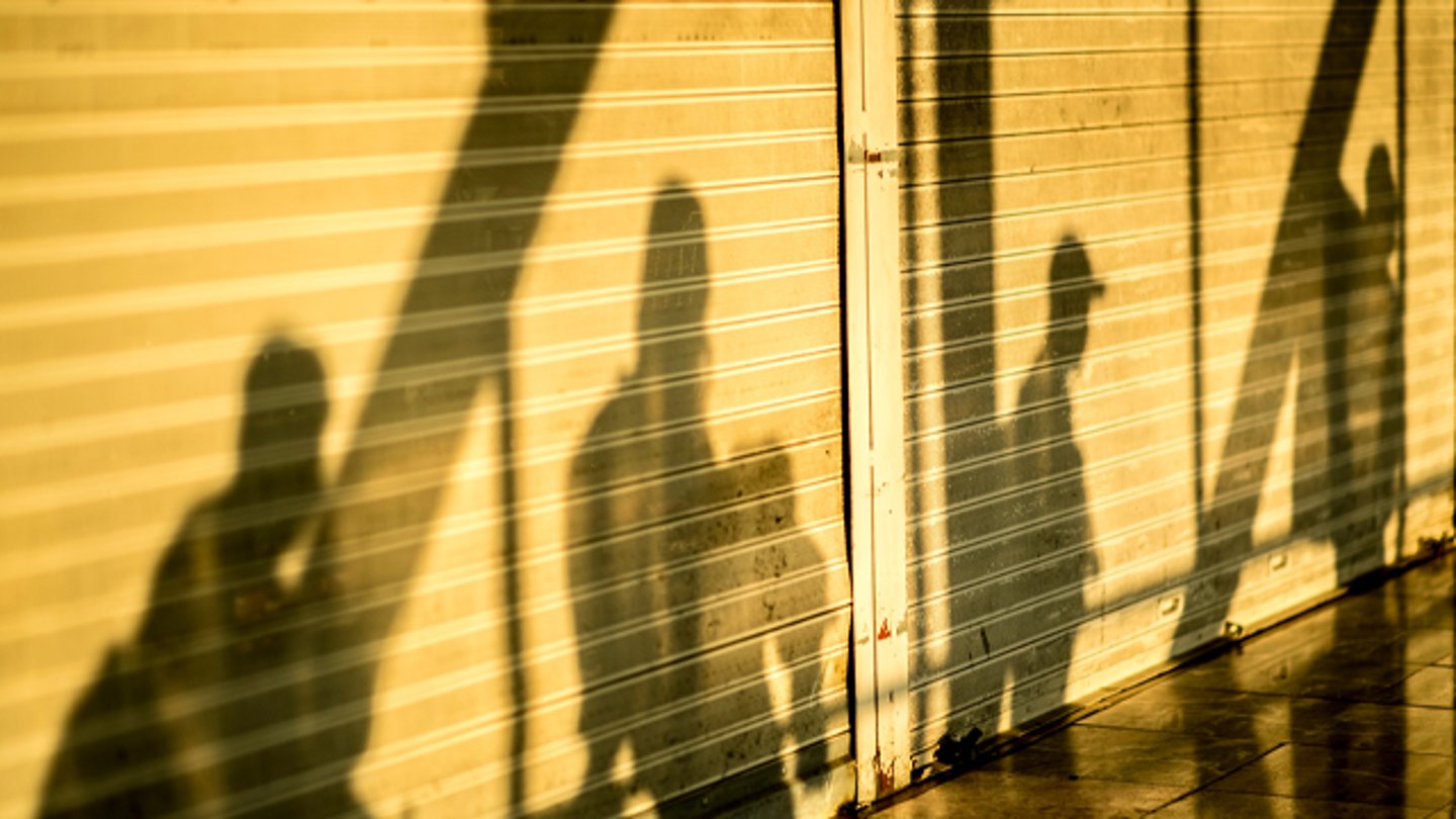 The shadows of people against a wall