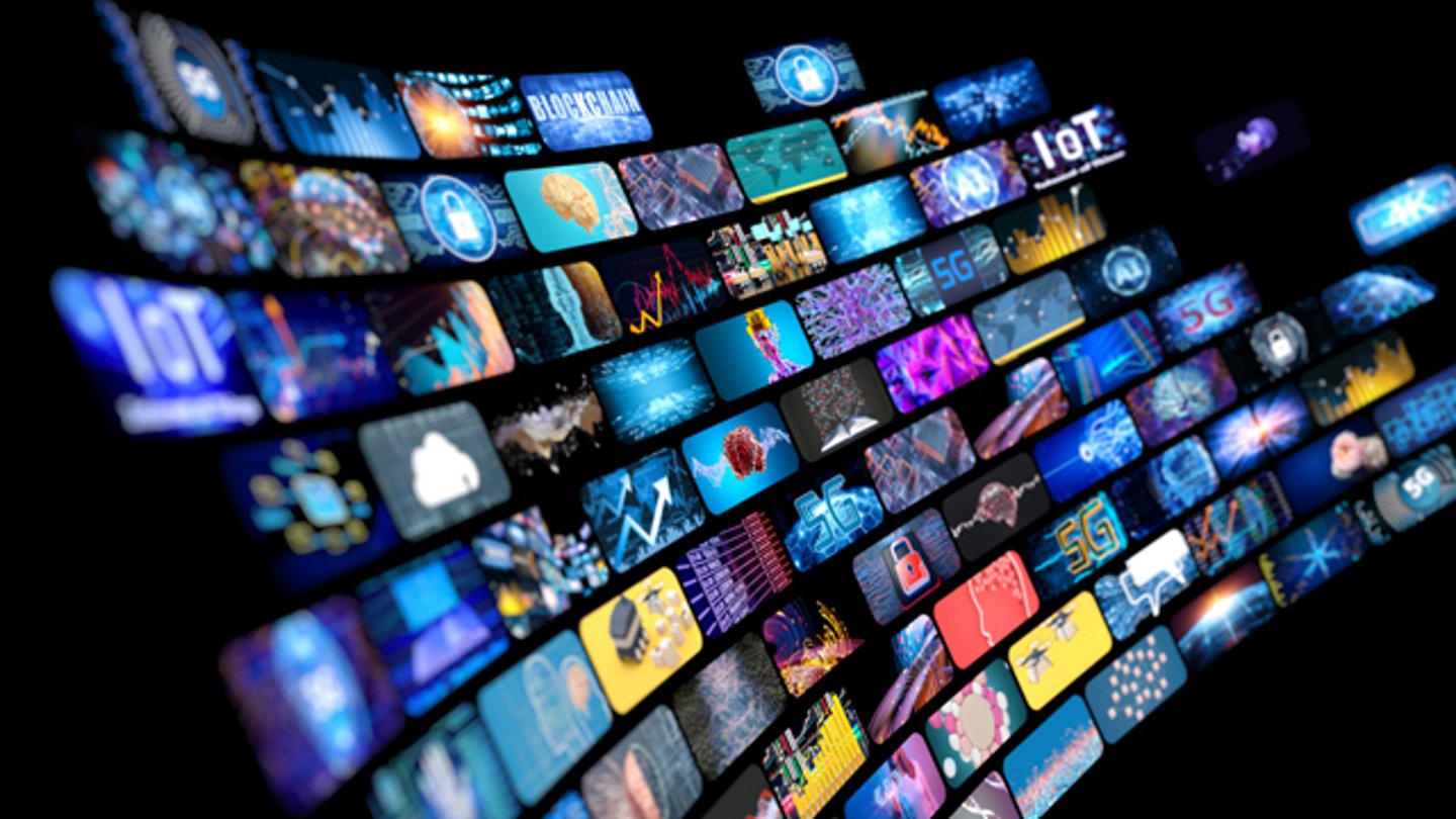 Numerous screens showing technology symbols like IoT