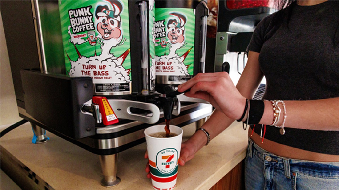 A customer pouring a cup of Punk Bunny Coffee