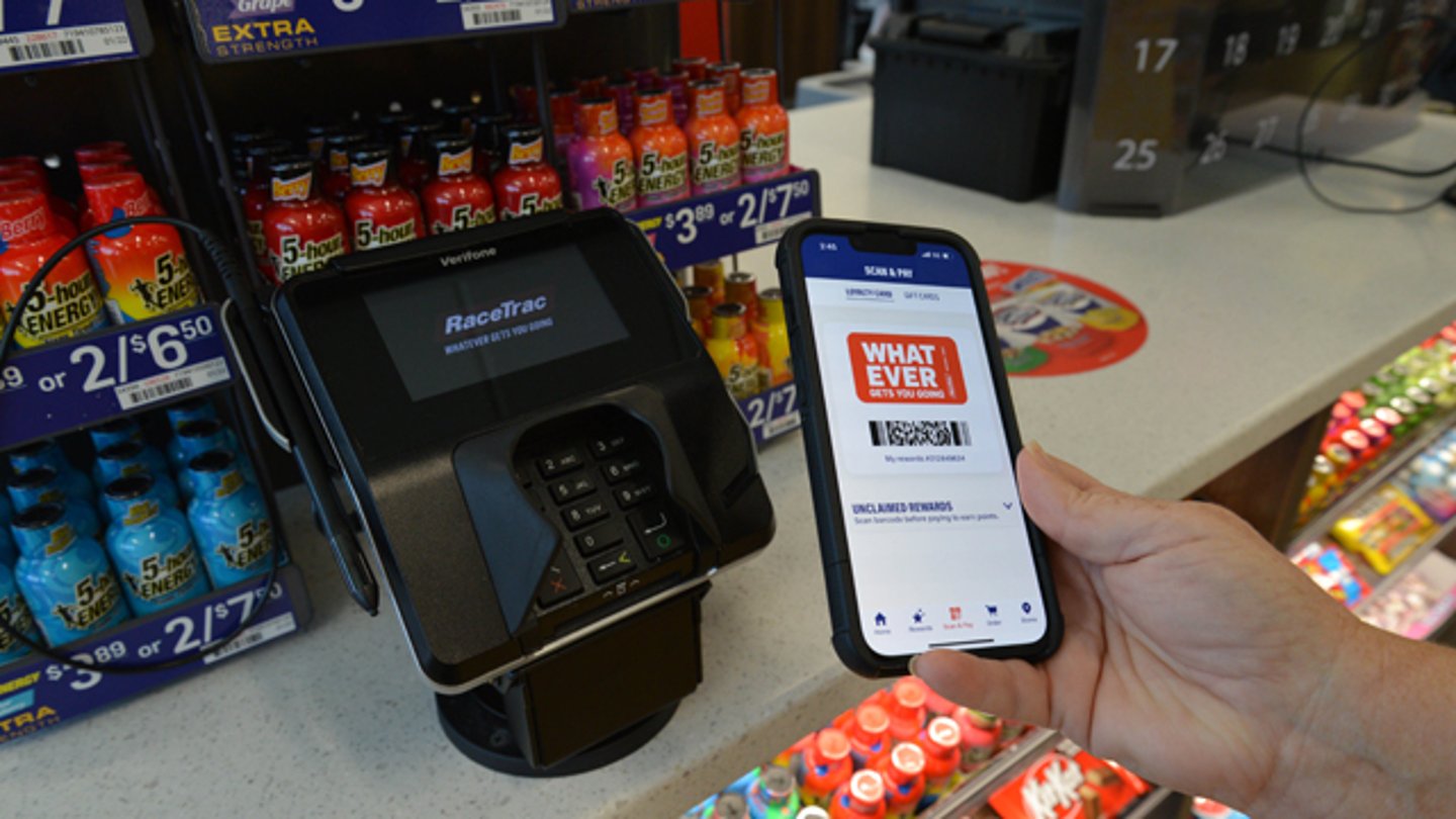 A person using RaceTrac's mobile app at checkout
