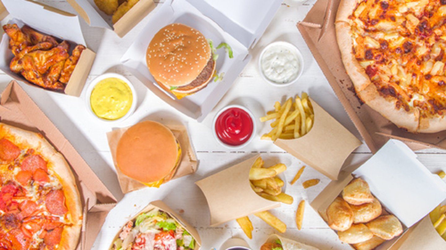 A selection of pizza, hamburgers and French fries