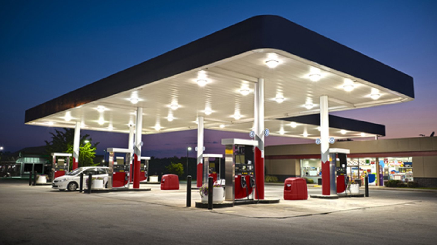 A convenience store gas station at night