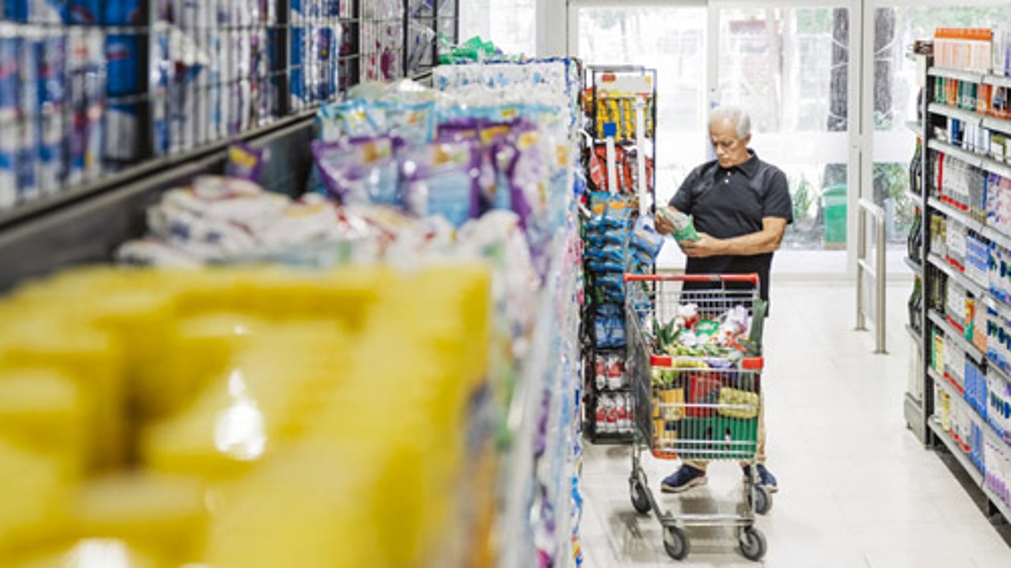 A man shopping at a dollar store