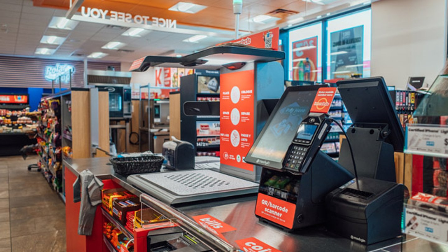 Self-checkout stations in a Circle K convenience store
