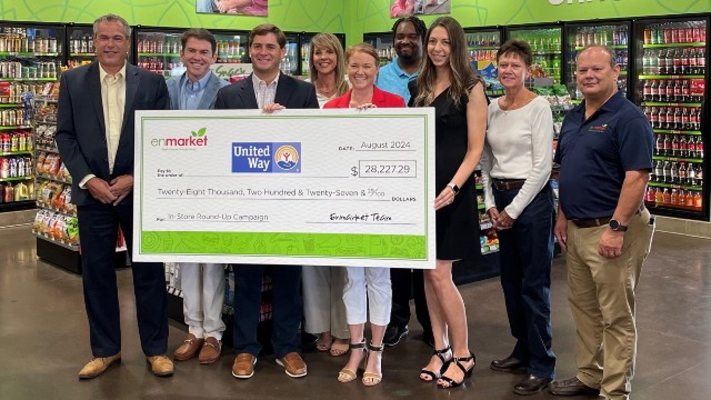 Enmarket donation check to the United Way