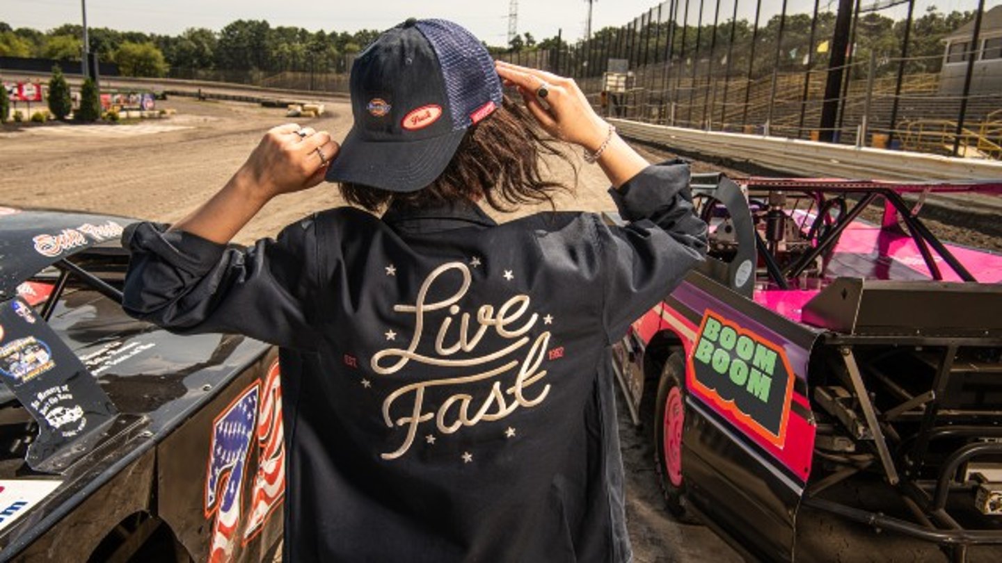 Woman wearing a Live Fast jacket from the Sheetz and Dickies collaboration