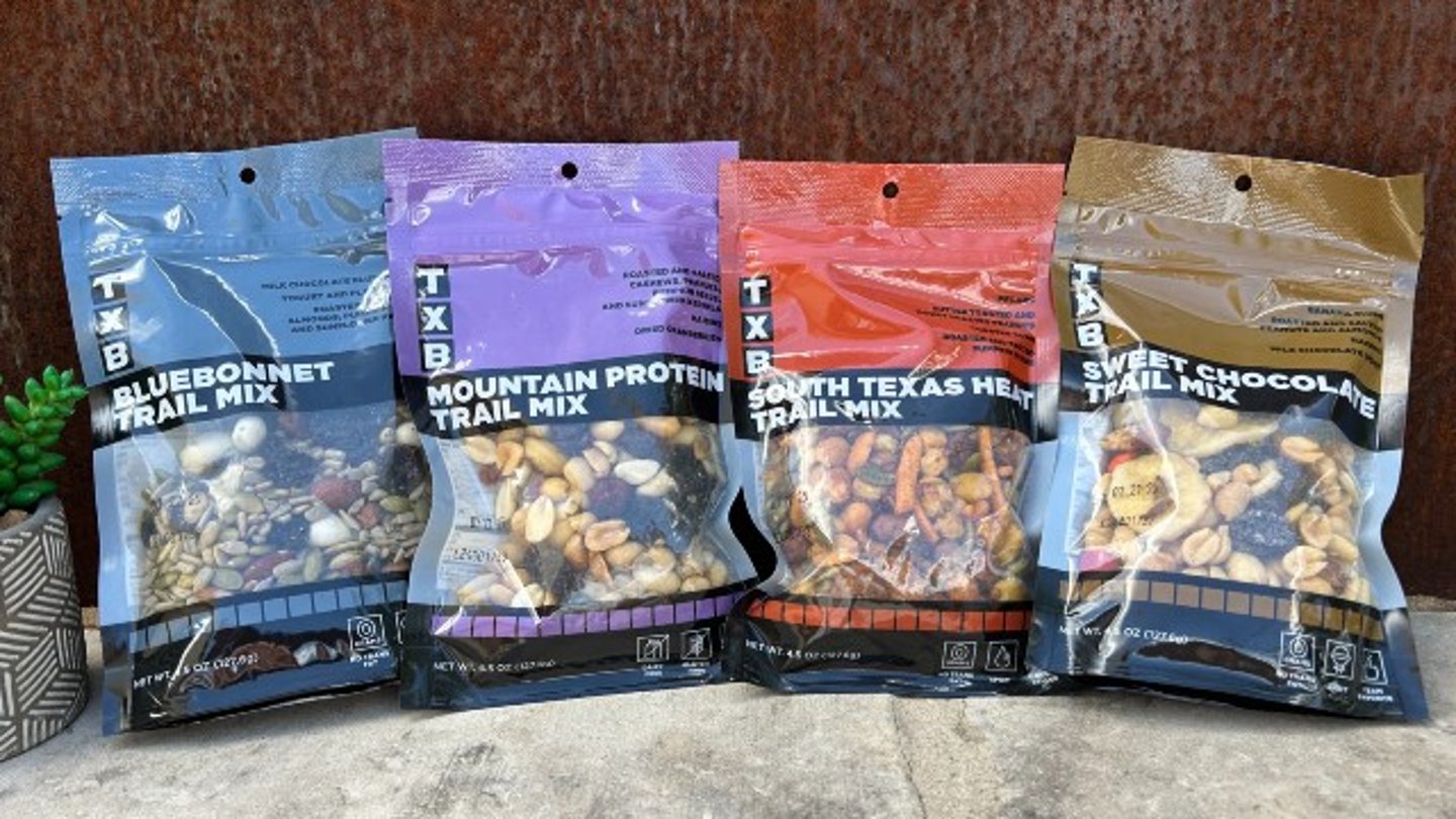 Four bags of TXB private label Trail Mix 